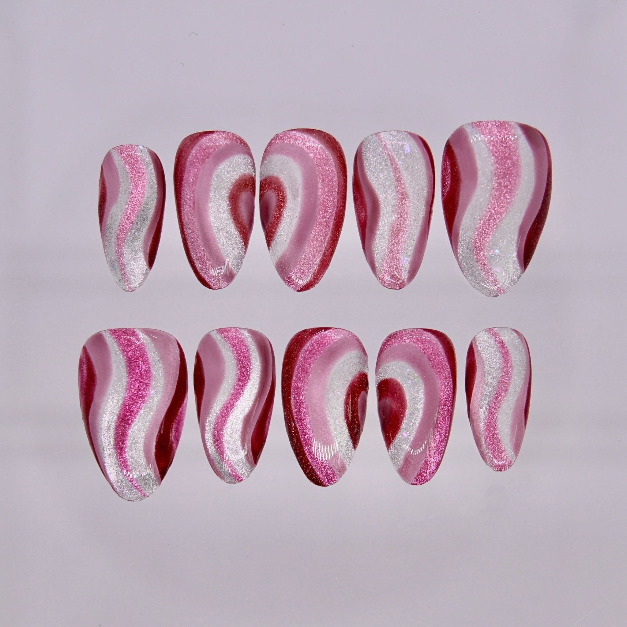 Dog zodiac press on nails with pink and red shimmer waves and flowing heart patterns, Endear self love energy
