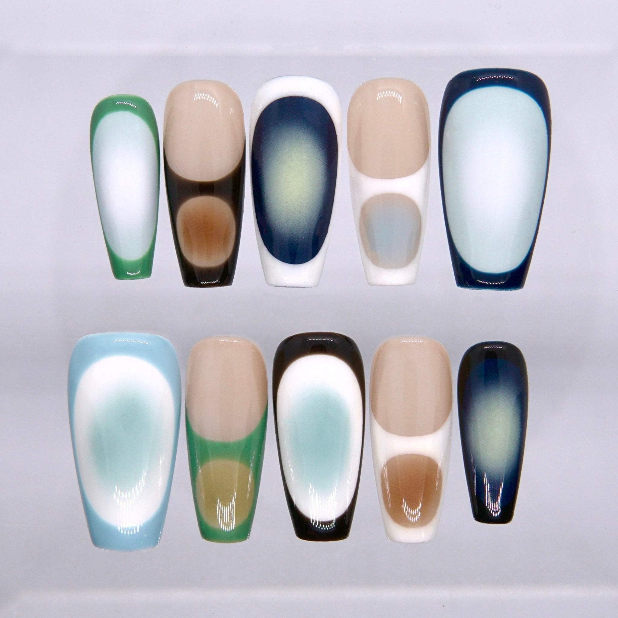 Long square press on nails with modern abstract blue, green, nude, black, and white framed color block design