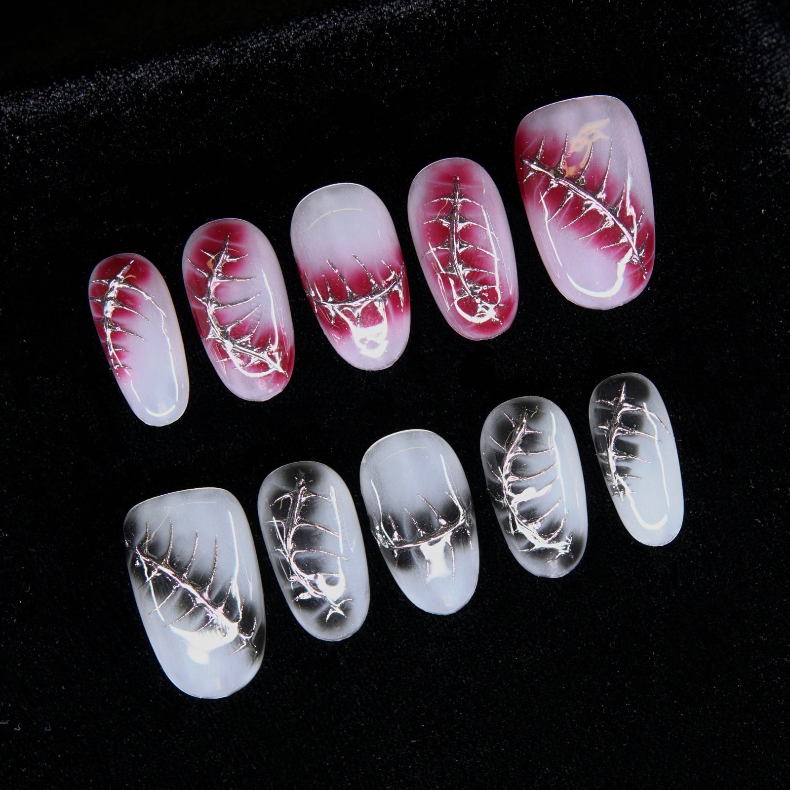 Close-up of chrome suture pattern on blood-red gradient.