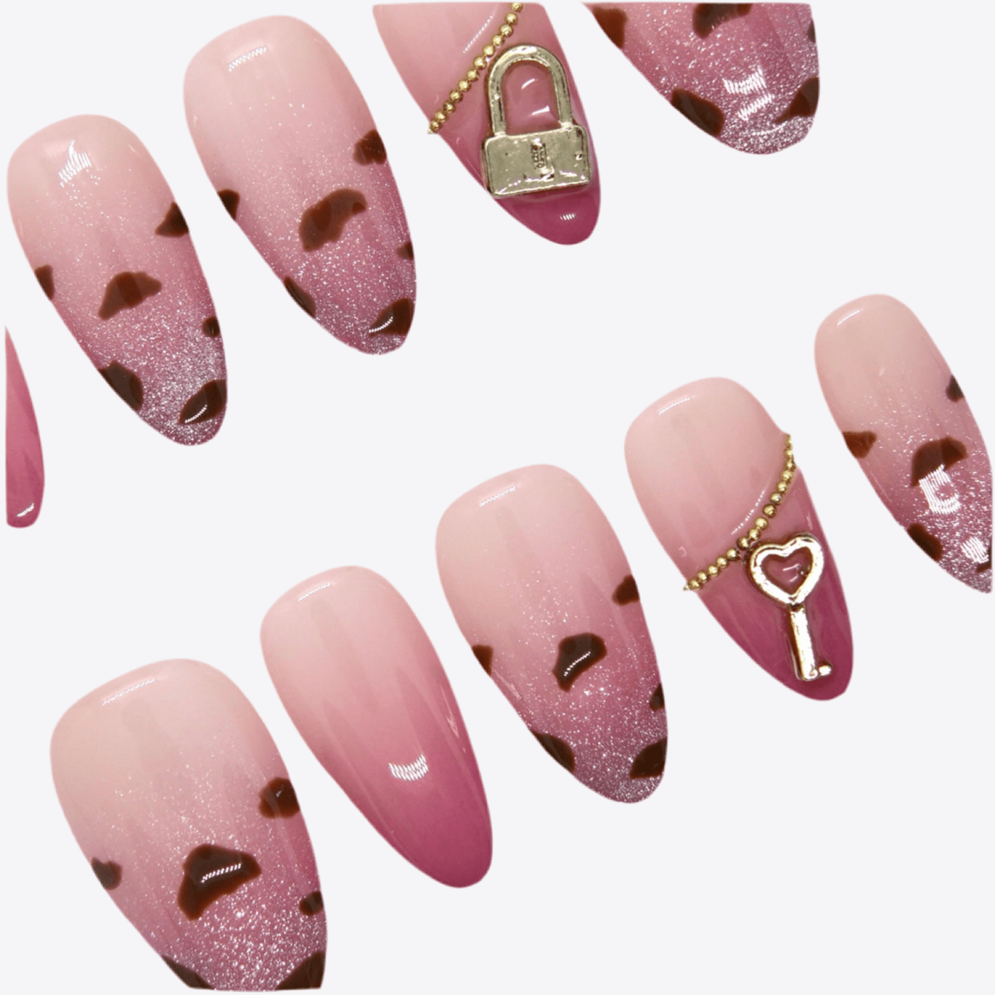 Close-up of gold padlock charm and soft pink ombré finish