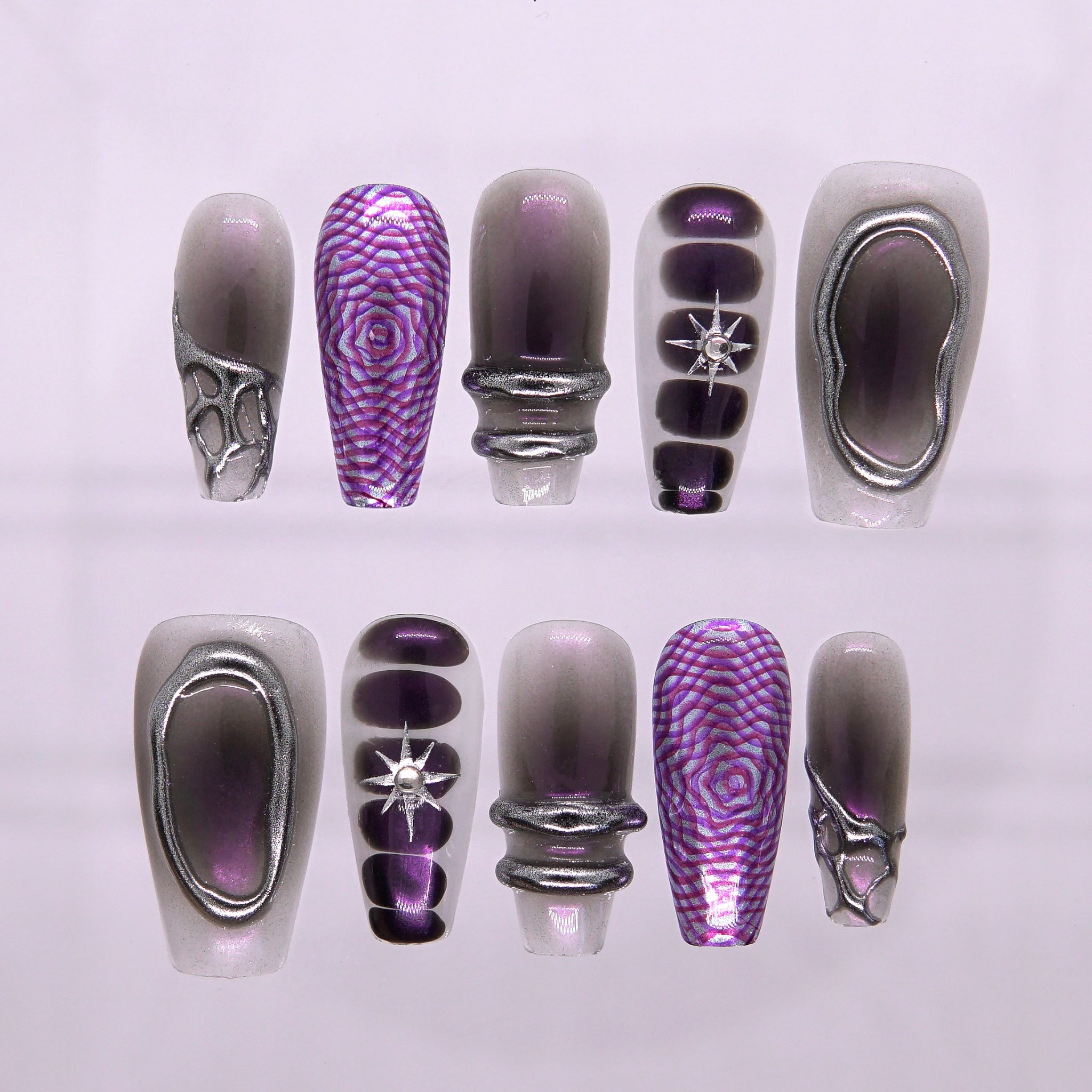Full set of Night Bloom press-on nails in purple-black gradient with chrome 3D accents and star rhinestones, Water Flow collection