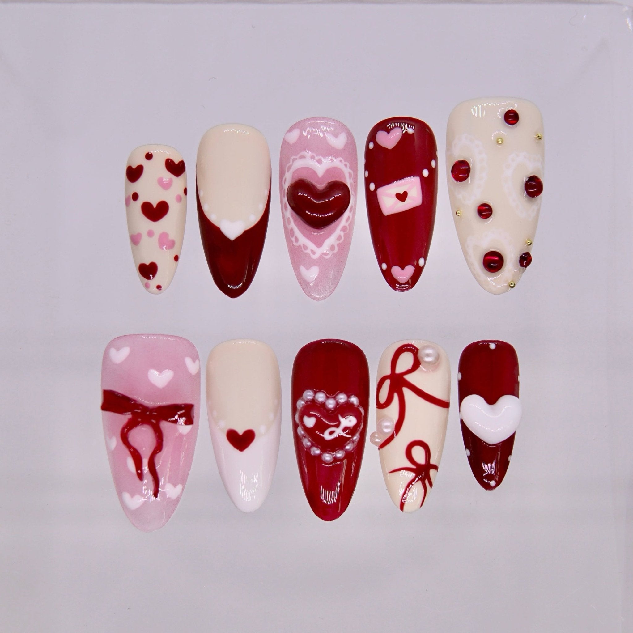 Rooster Radiance Valentine zodiac press on nails in red and blush tones