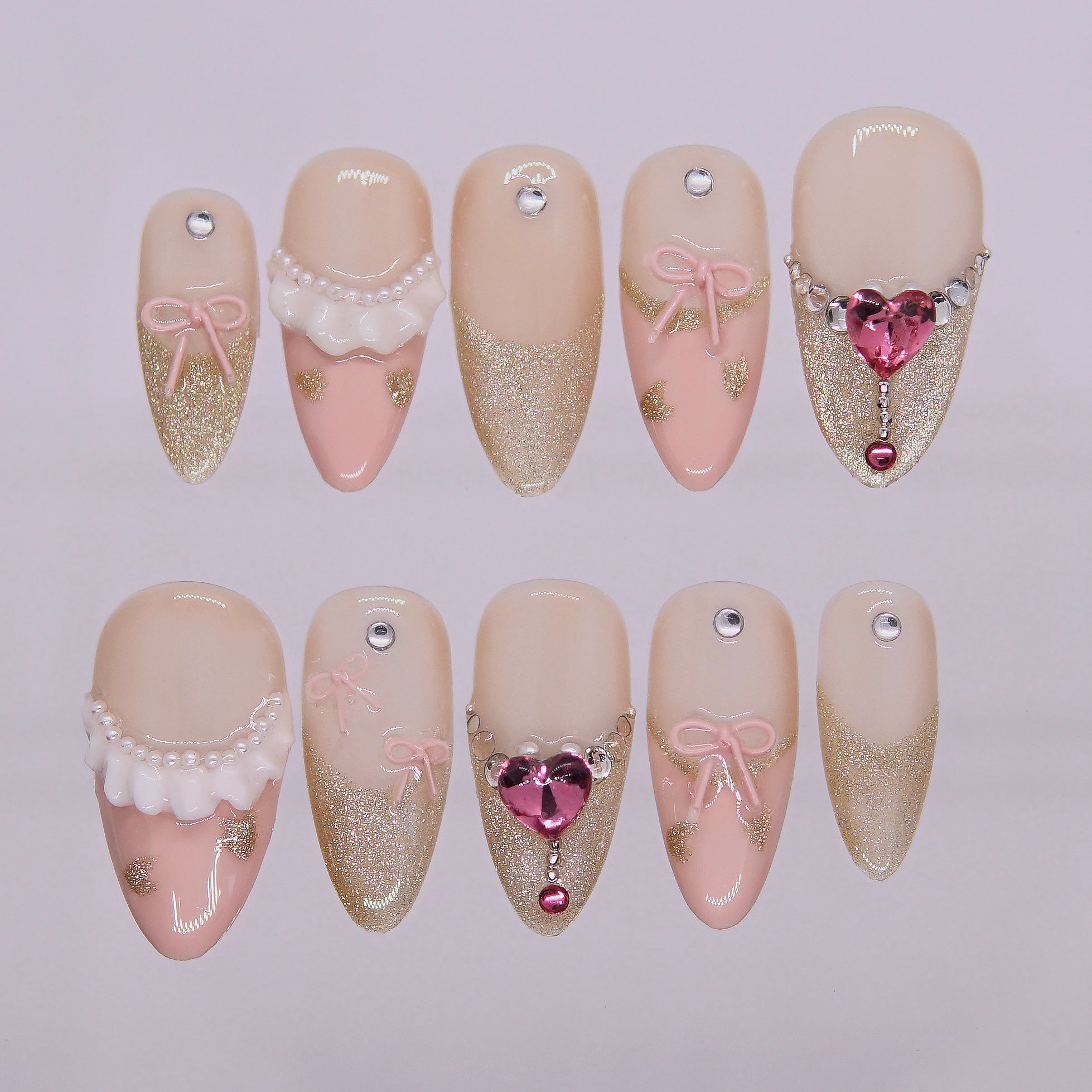 Sugar Dream press-on nails in soft pink with 3D bow and heart charm – Ribbon Agenda full set overview