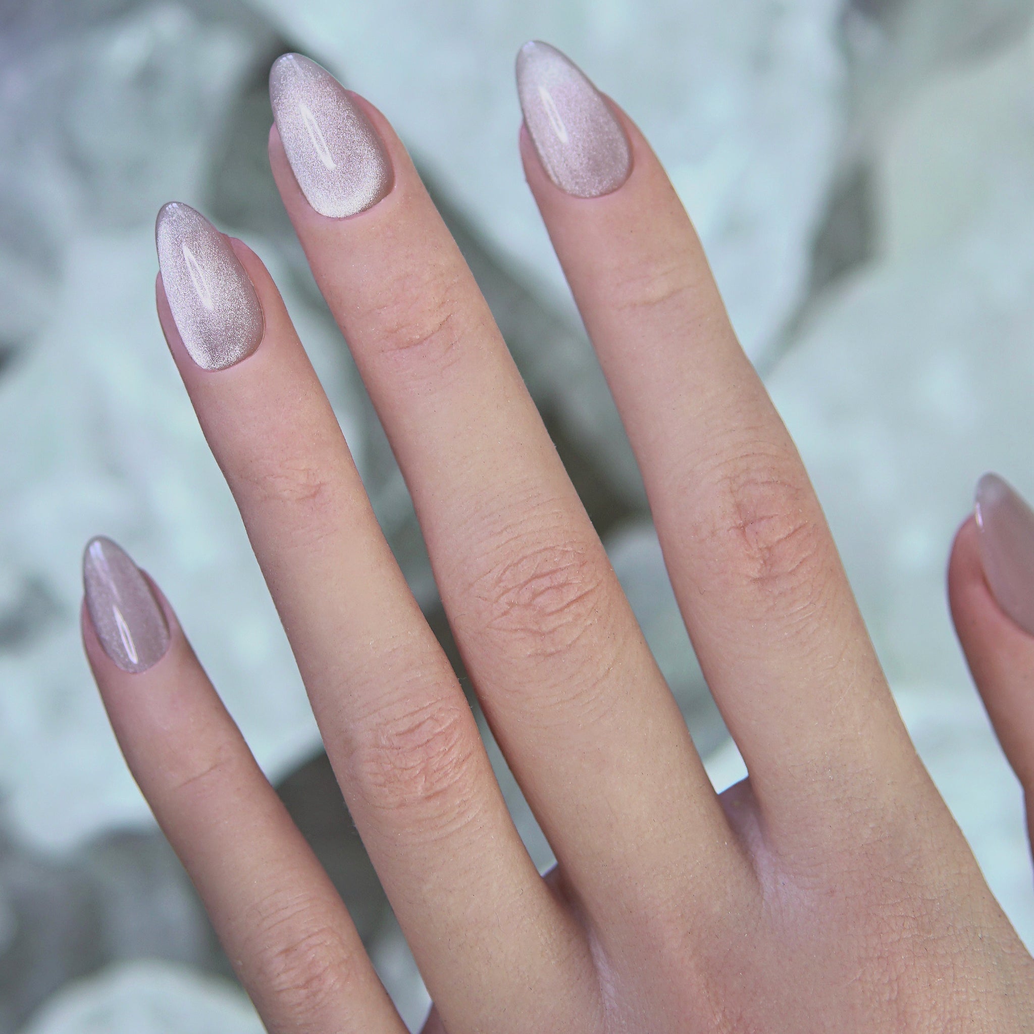 Model wearing Silver Focus silver press-on nails, catching light for a clean, focused aesthetic.