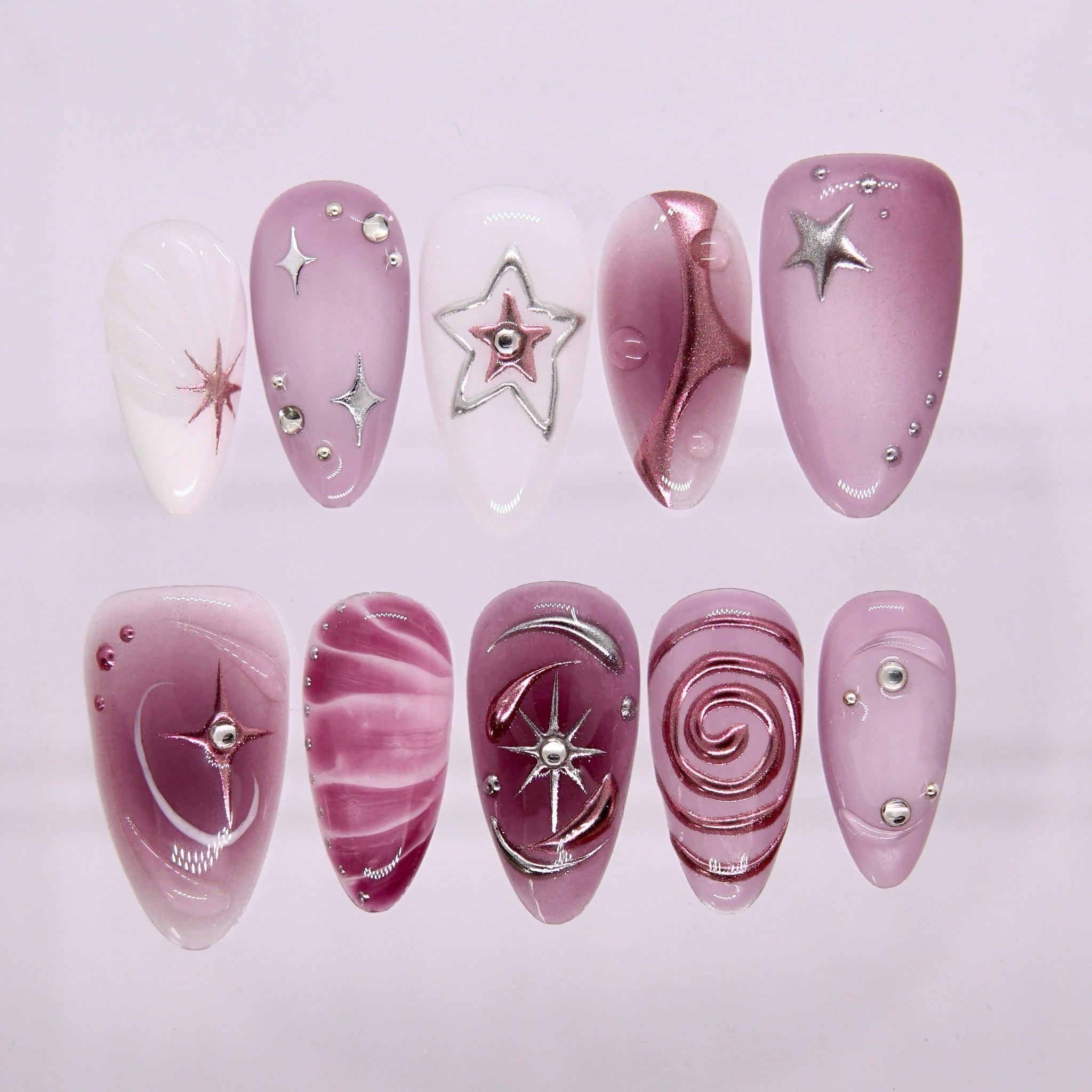 Starlit Orbit press-on nails in lilac cat-eye finish with silver star and moon details.